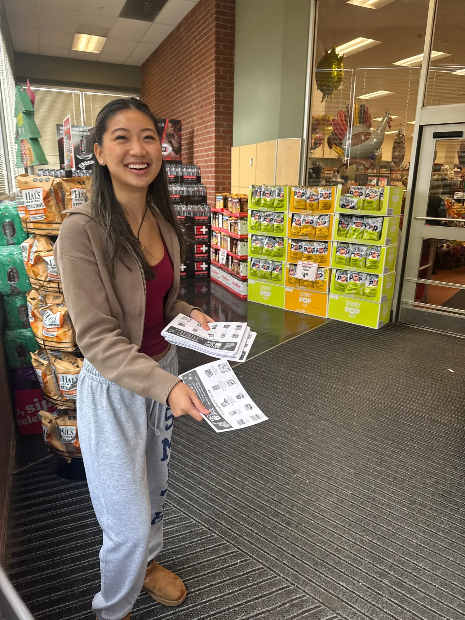 A volunteer handing out information sheets