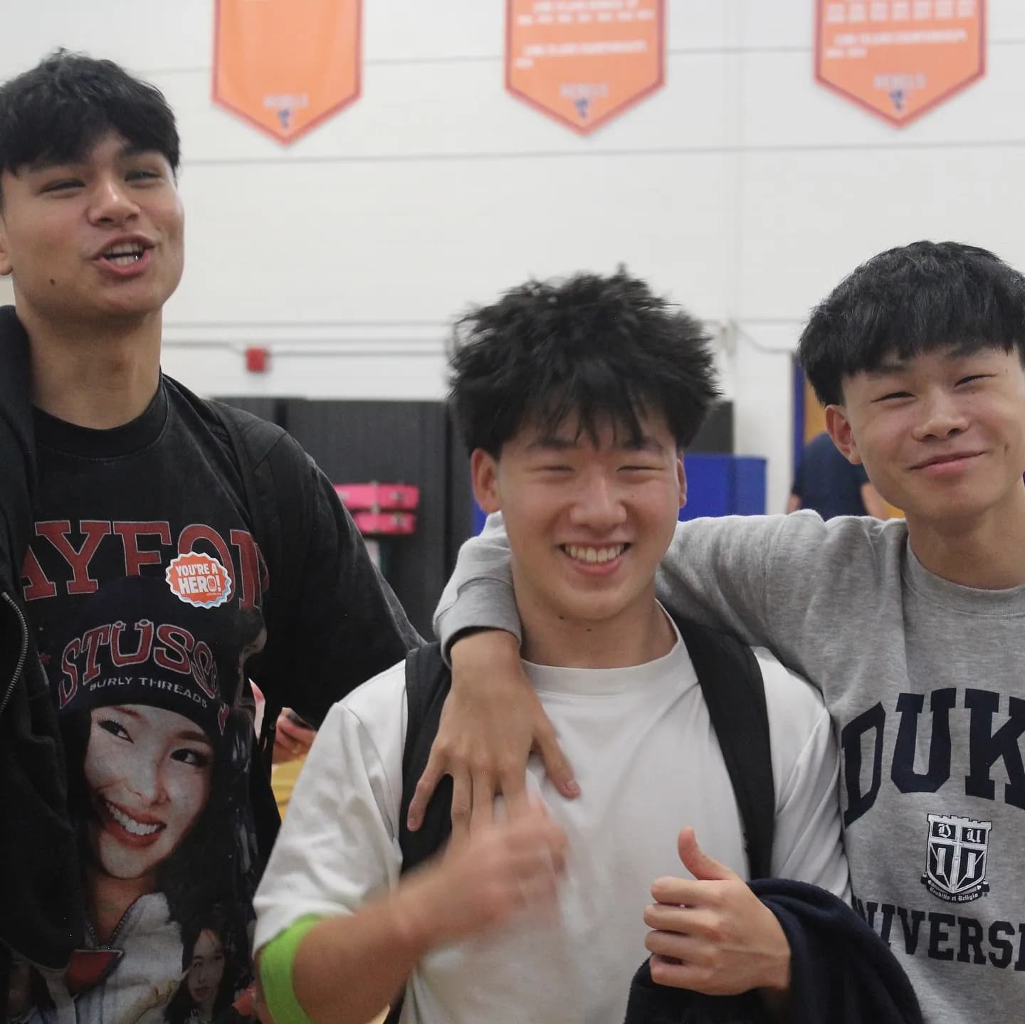 Students giving a thumbs up after registering