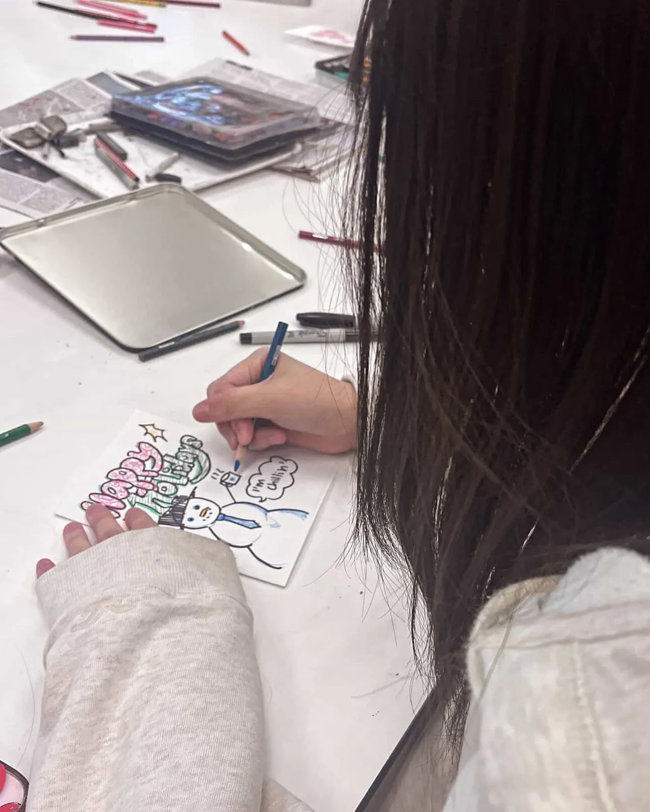 A student drawing a card